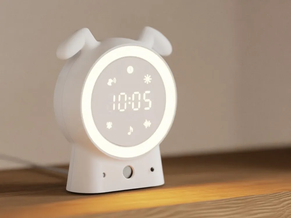 SilentBuddy glowing on a wooden shelf, showing 10:05