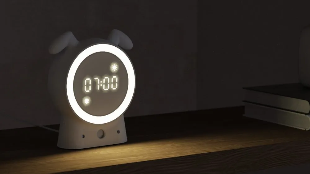 SilentBuddy at 07:00 with its light ring glowing in a dark room